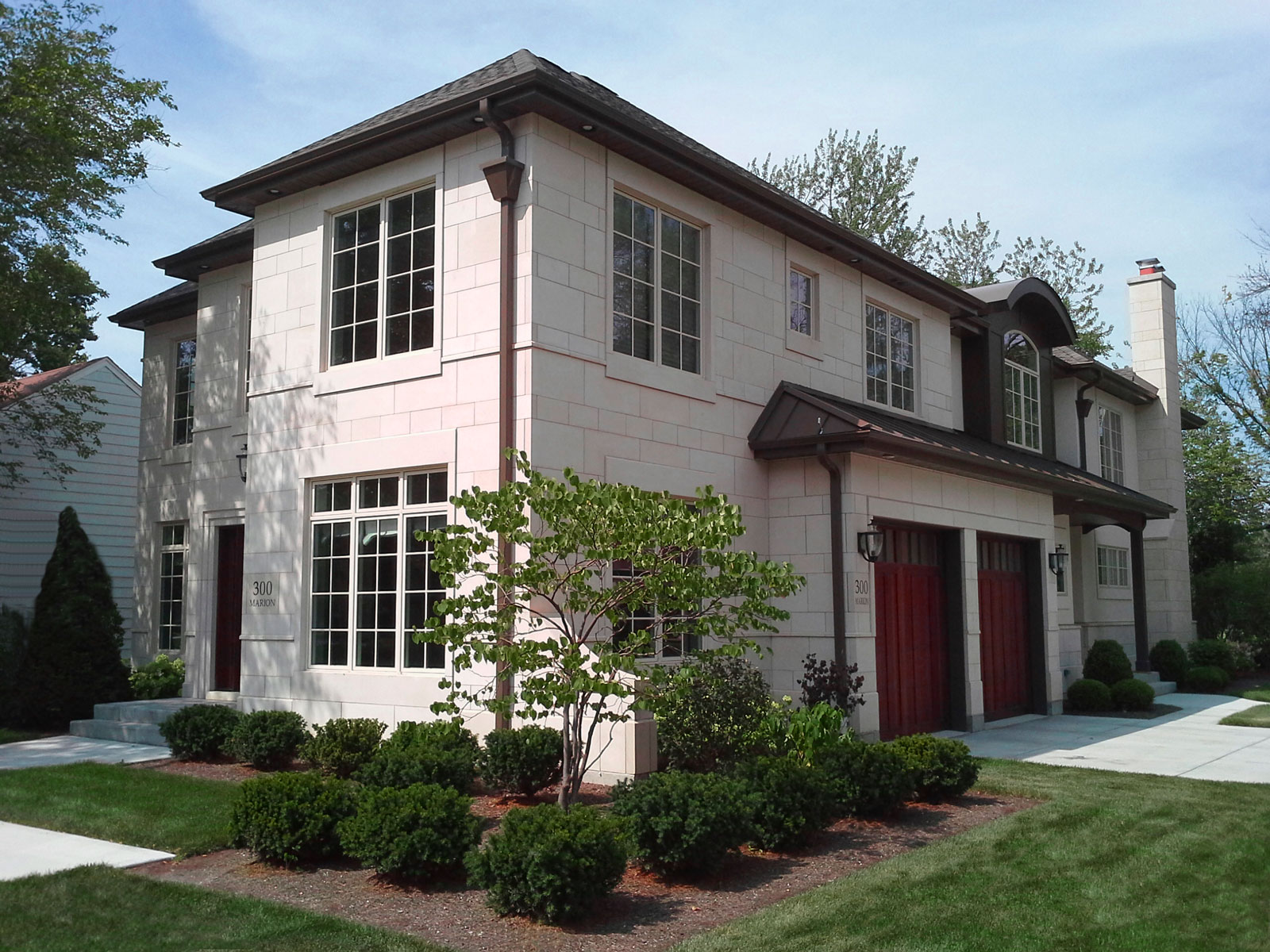New Construction French Manor styled home with cut stone exterior in Elmhurst, IL.