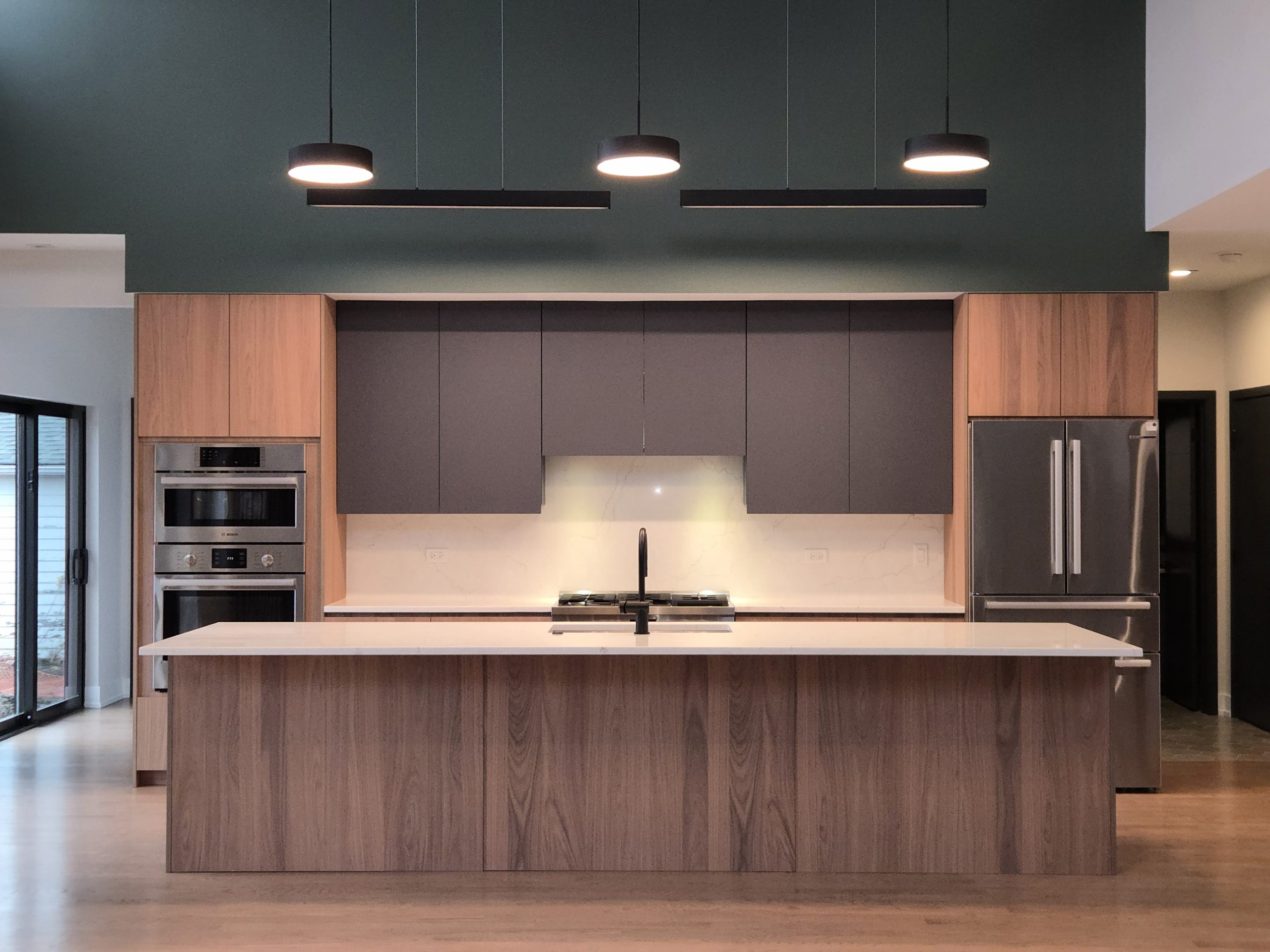 Modern kitchen with wood and gray.
